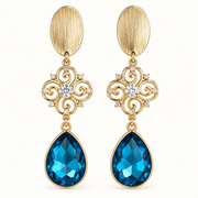 Aros Azul Imperial dorados con cristal azul en forma de gota y detalles de circones