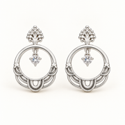 Aros Karla Plata de diseño circular con cristal brillante y detalles ornamentales en acabado plateado.