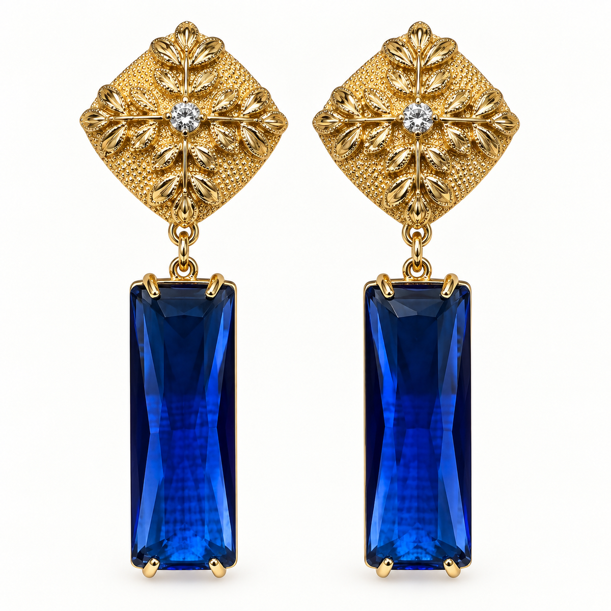 Aros dorados con base floral y cristal azul facetado rectangular MCJoyas