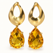 Aros dorados con cristal amarillo facetado en forma de gota MCJoyas