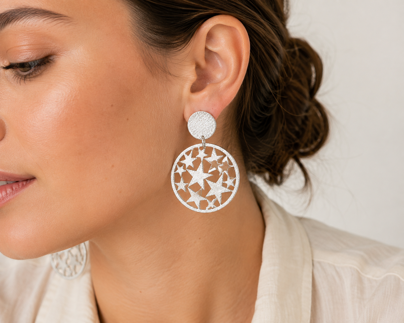 Aros estrellas caladas silver puestos